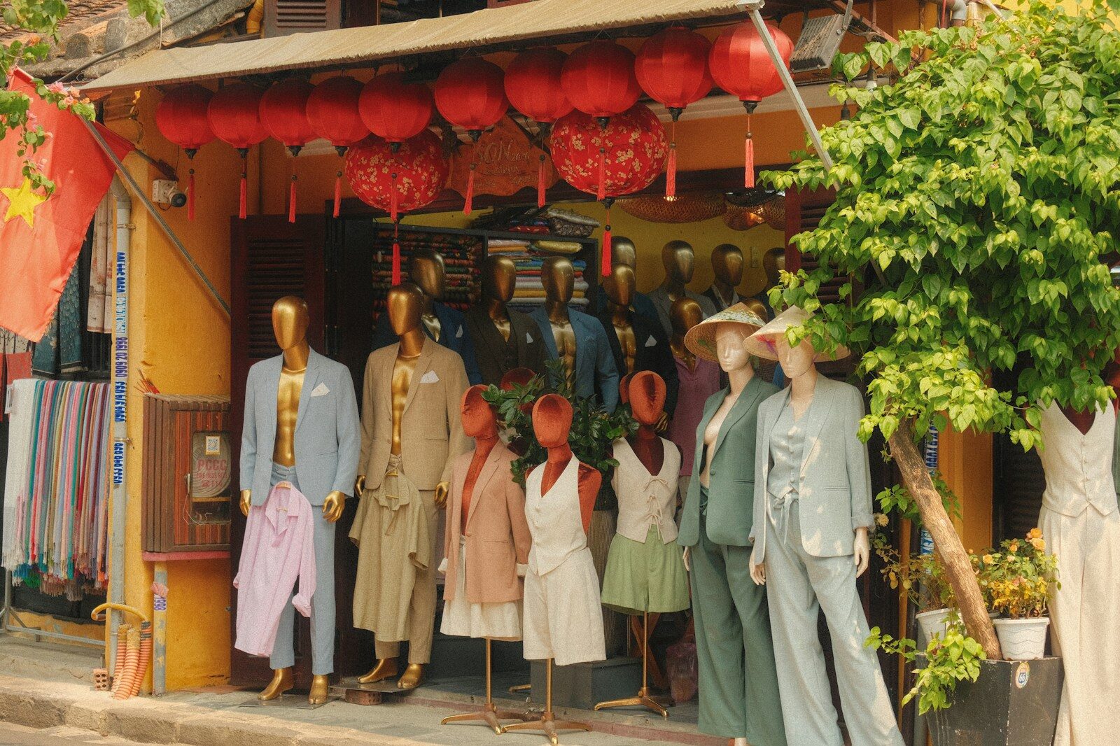 Mannequins display clothing outside a shop entrance